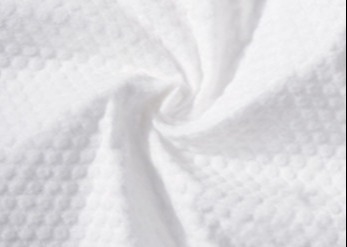 comprar Protección del medio ambiente grabada en relieve de la tela no tejida de Spunlace para la toalla comprimida online manufacture